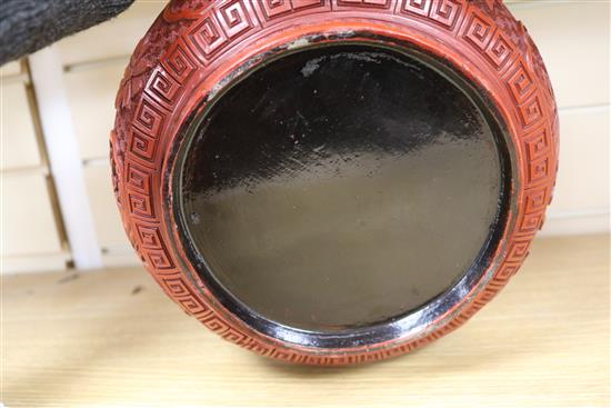 A 19th century Chinese cinnabar lacquer box and cover, diameter 10in.